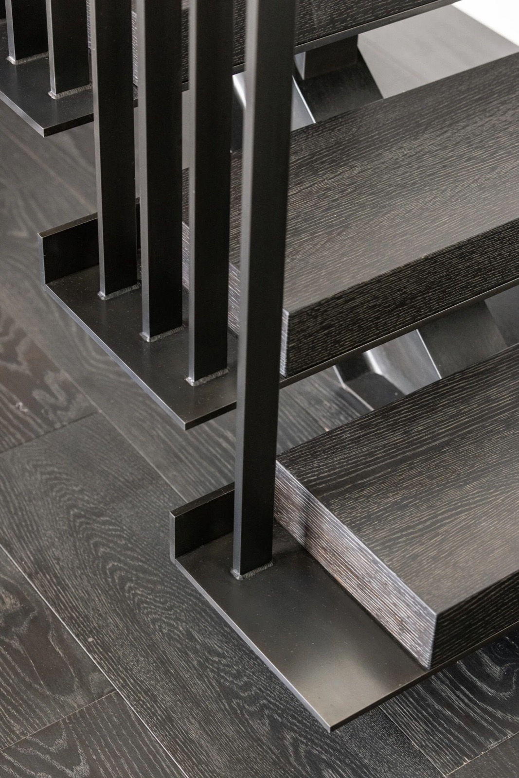 A stair under construction, its stringers and framing exposed on the jobsite