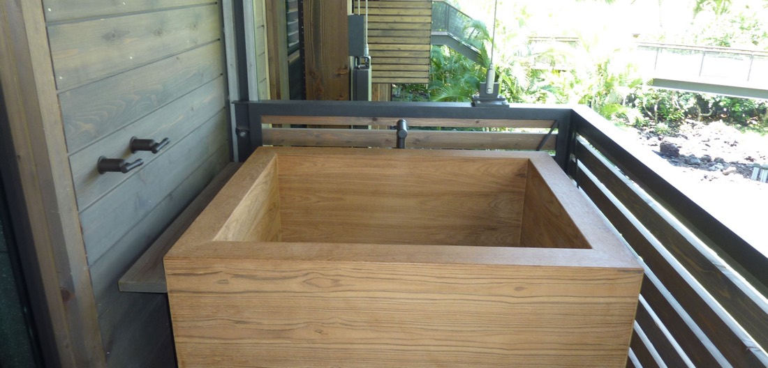 Wood soaking tub with tongue-and-groove walls