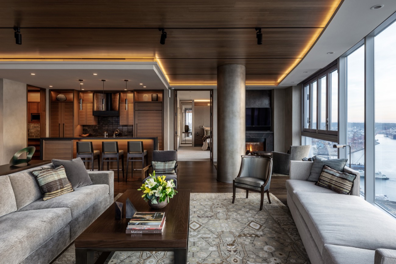 Waterside living room with paneling and a view
